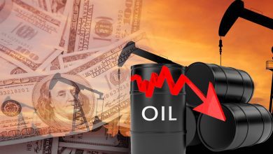 Oil barrels with a red downward trend arrow, an oil pump silhouette, and dollar bills in the background signaling falling oil prices.]
