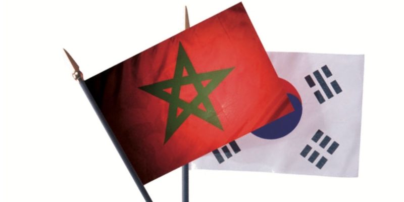 2156487 | MCG24 | موقع إلكتروني مغربي شامل متجدد على مدار الساعة Morocco flag with a green pentagram waving in front of a South Korea flag behind it.",