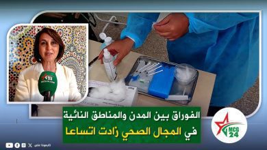 News collage: a woman being interviewed with a green MCG24 microphone, beside a medical worker handling syringes and supplies; Arabic headline banner visible.