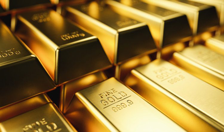 Stack of shiny gold bars in a vault, labeled 999.9 fine gold.