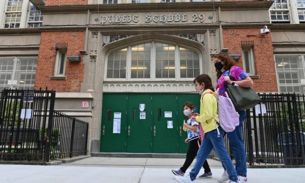 90545465_FILES-In-this-file-photo-students-walk-past-a-public-school-on-October-5-2020-in-the-Br | MCG24 | موقع إلكتروني مغربي شامل متجدد على مدار الساعة