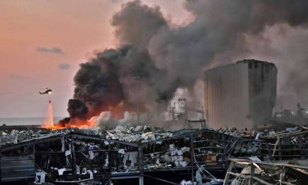 89048016_EDITORS-NOTE-Graphic-contentA-helicopter-puts-out-a-fire-at-the-scene-of-an-explosion-at | MCG24
