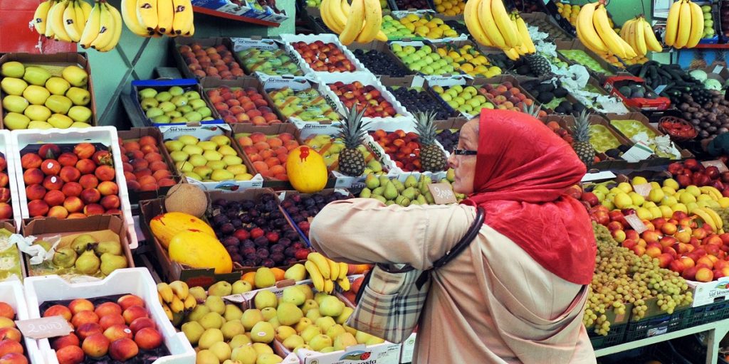 A customer waits to be served at a fruit | MCG24 | موقع إلكتروني مغربي شامل متجدد على مدار الساعة