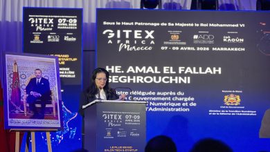 Female speaker at a podium during the SITEX Africa Morocco conference, with blue banners showing 07-09 Avril 2026 Marrakech.