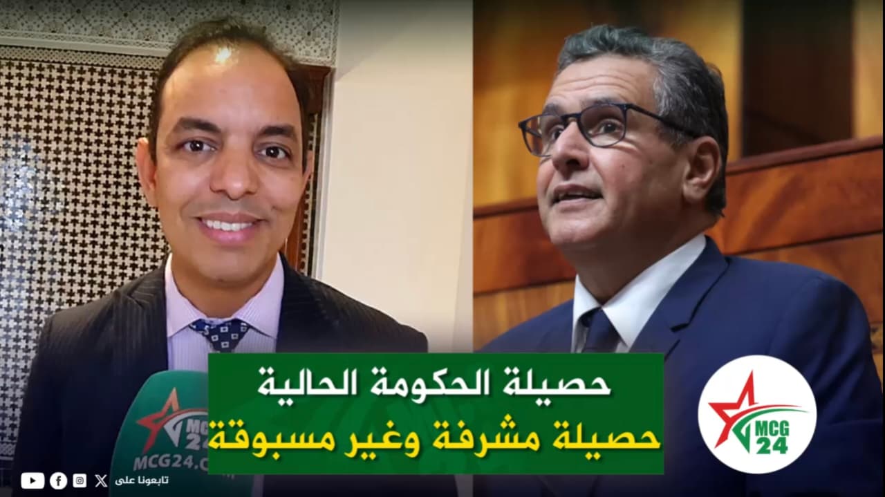 Split-screen interview: left man in a dark suit smiling, holding a green MCG24 microphone; right man in glasses in a wood-paneled room; bottom Arabic caption about government results.