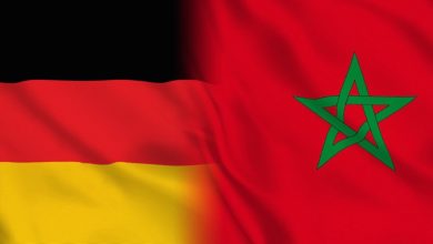 Germany flag on the left and Morocco flag on the right, showing black-red-gold stripes beside a red field with a green pentagram, representing two nations side by side on one image.