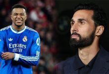 Two men side by side: left is a Real Madrid footballer in a blue kit smiling, right is a bearded man in a dark suit looking away.