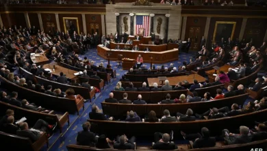 1424125jpeg | MCG24 | موقع إلكتروني مغربي شامل متجدد على مدار الساعة Full view of a legislative chamber with a central dais, American flag, and rows of seated lawmakers