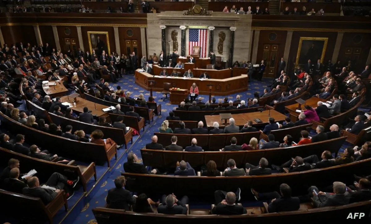 Full view of a legislative chamber with a central dais, American flag, and rows of seated lawmakers