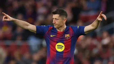 1778934826222 | MCG24 | موقع إلكتروني مغربي شامل متجدد على مدار الساعة FC Barcelona player in blue-red home kit celebrating on the pitch with arms outstretched and Spotify logo visible on the chest.