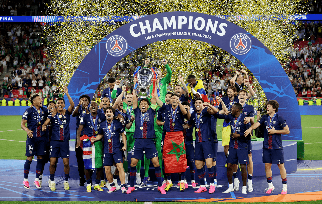 1780169530543_346a885e-3471-4c62-b4b2-92e097c8bea41080 | MCG24 | موقع إلكتروني مغربي شامل متجدد على مدار الساعة Paris Saint-Germain players celebrate lifting the UEFA Champions League trophy under a blue arch, gold confetti raining down the scene at the 2026 final.