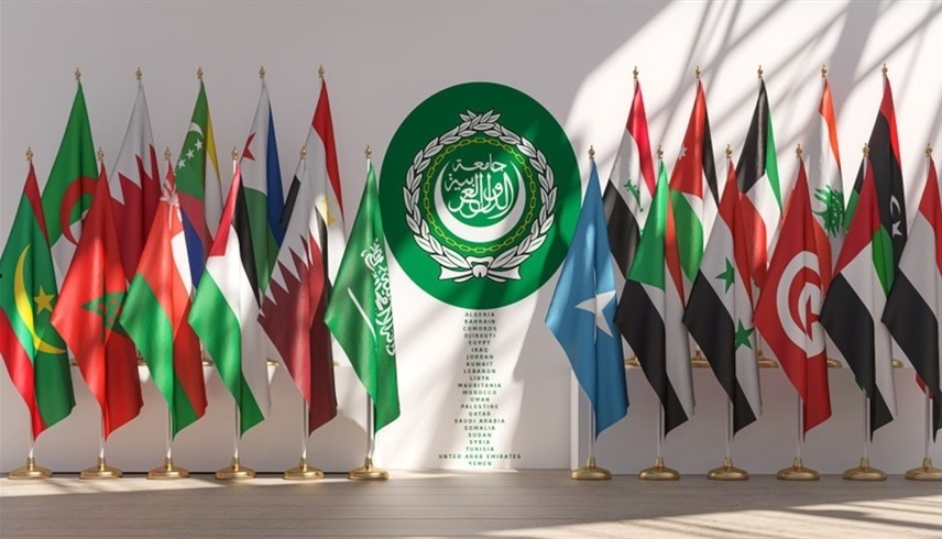 202659103148354R4 | MCG24 | موقع إلكتروني مغربي شامل متجدد على مدار الساعة Row of national flags surrounding a central green emblem of the Arab League on a white backdrop.
