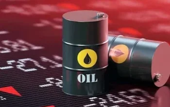 Two black oil barrels with yellow drop symbol, one upright and one tipped over, on a dark market backdrop with numbers and red accents.