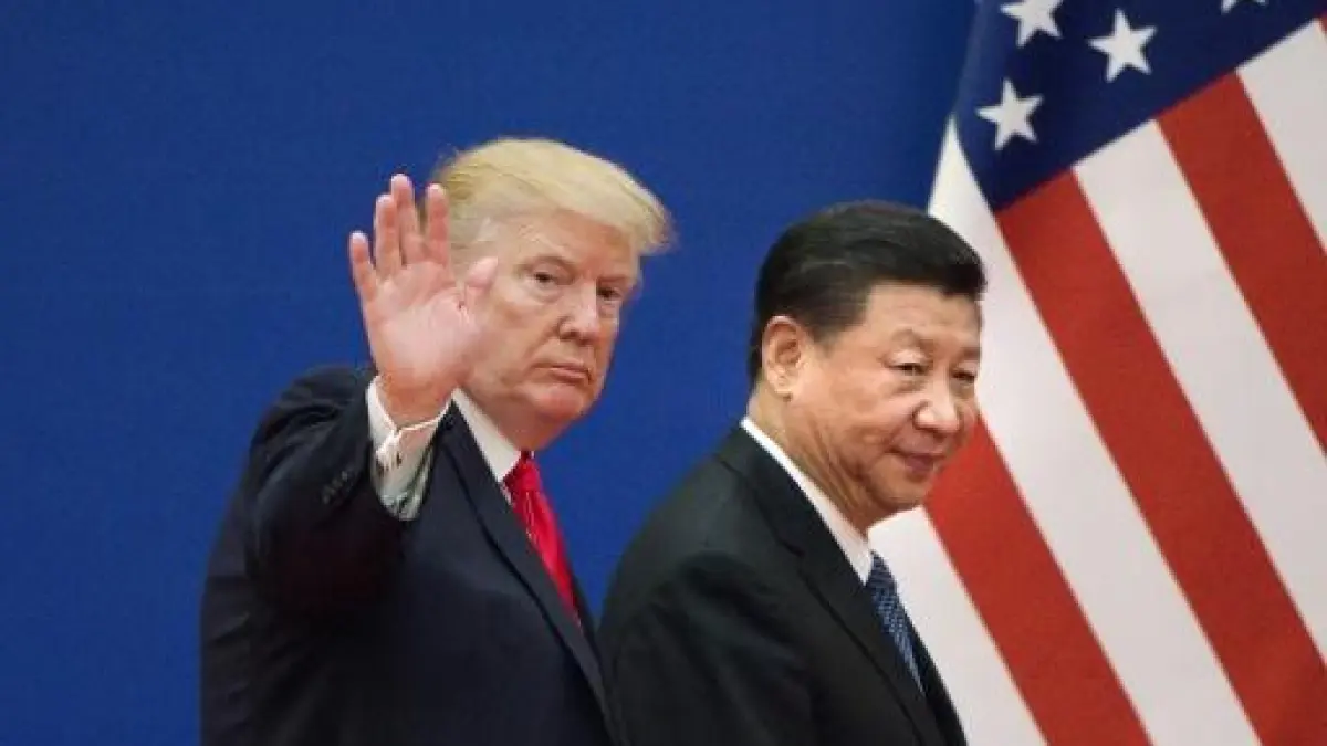 Donald Trump waves beside Xi Jinping at a formal event, with the U.S. flag in the background.