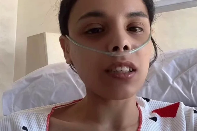 6a05c23a5c7e7 | MCG24 | موقع إلكتروني مغربي شامل متجدد على مدار الساعة Woman in a hospital bed speaking to the camera, wearing a nasal oxygen cannula.