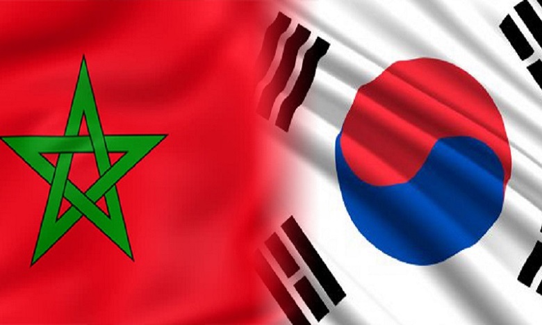 Two national flags side by side: Morocco on the left (red field with a green pentagram) and South Korea on the right (white field with red-blue circle and black trigrams).