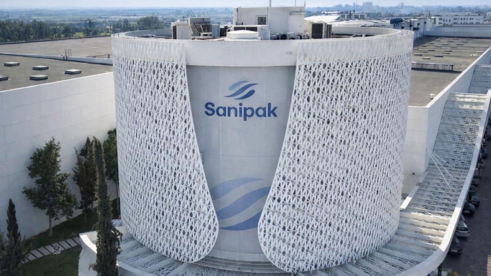 96648924-67370184 | MCG24 | موقع إلكتروني مغربي شامل متجدد على مدار الساعة A cylindrical white building with a decorative white lattice facade and the Sanipak logo in the center (aerial view).**