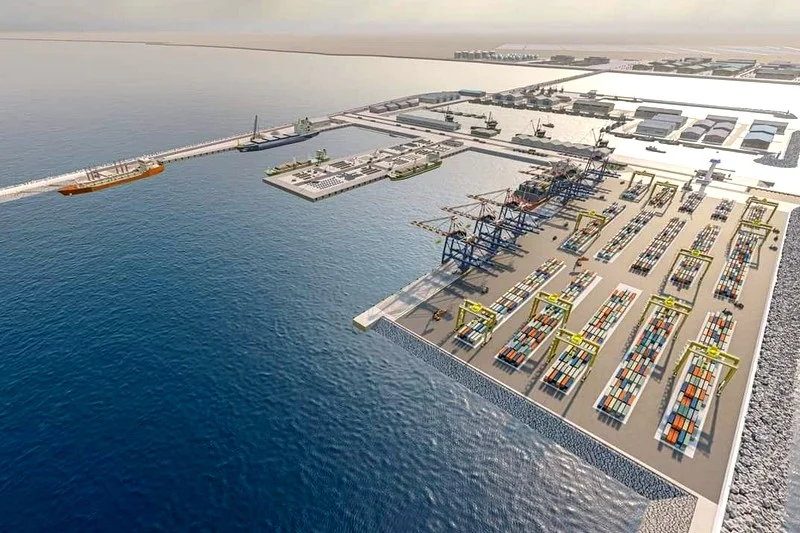 DAKHLAATLANTIC | MCG24 | موقع إلكتروني مغربي شامل متجدد على مدار الساعة Aerial view of a busy container port with cranes, docks, and rows of stacked shipping containers by the water