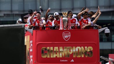 WhatsApp Image 2026-05-31 at 155749 | MCG24 | موقع إلكتروني مغربي شامل متجدد على مدار الساعة Arsenal players celebrate on a red double-decker bus, raising their arms around the Premier League trophy.