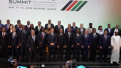 Group photo of diverse world leaders in suits on stage at the Africa–France Summit in Nairobi, Kenya (May 11–12, 2026).