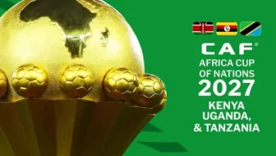 AFCON 2027 trophy with a gold ball and small globe accents on a green background, logo and host nations Kenya, Uganda, Tanzania.png