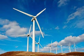 téléchargement 45 | MCG24 | موقع إلكتروني مغربي شامل متجدد على مدار الساعة Wind turbines on a hill under a blue sky, part of a wind farm.