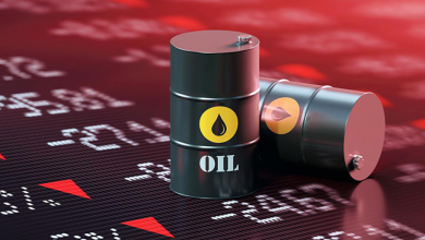 Oil barrels on a dark stock market background with red price indicators, symbolizing crude oil prices.