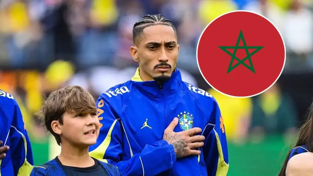 6a29c5ffa9193d59c3ee3594_default | MCG24 | موقع إلكتروني مغربي شامل متجدد على مدار الساعة Brazilian soccer player in a blue jacket with hand over heart stands beside a smiling boy on a soccer field, with a Morocco flag icon in the corner.