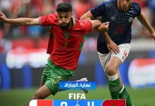 Soccer players clash for the ball on a field; UAE and Morocco flags shown, score UAE 0–Morocco 4, with 'End of match' text in Arabic and FIFA/MCG logos.