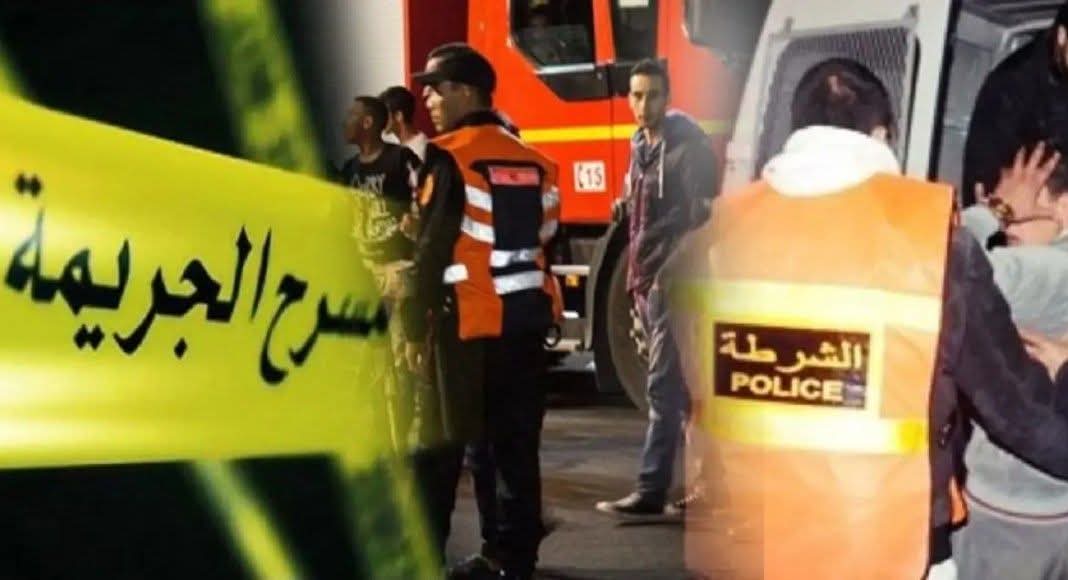 FB_IMG_1781474494793 | MCG24 | موقع إلكتروني مغربي شامل متجدد على مدار الساعة Emergency scene with police and responders behind yellow caution tape with Arabic writing; a police vest is visible in the foreground.