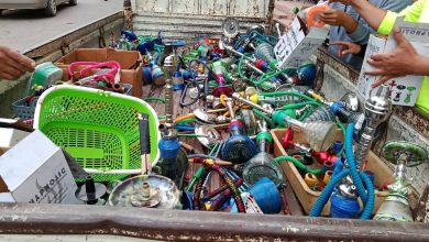 IMG-20260610-WA0344 | MCG24 | موقع إلكتروني مغربي شامل متجدد على مدار الساعة Pickup truck bed overflowing with colorful hookah hoses, bowls, and accessories, as vendors handle boxes and items nearby