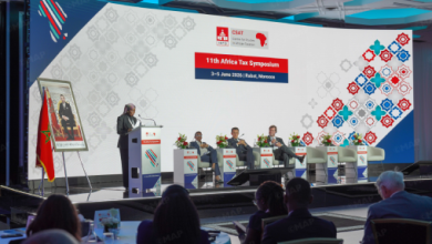 Panel discussion on stage at the 11th Africa Tax Symposium in Rabat, Morocco (June 3–5, 2016) with an audience watching the panelists.