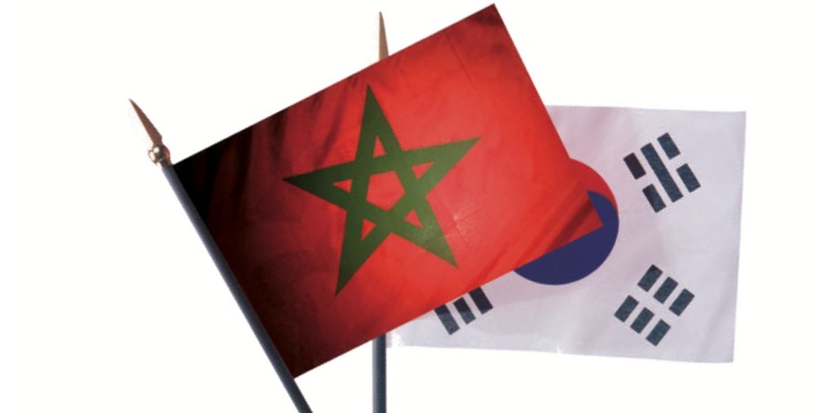 2156487 | MCG24 | موقع إلكتروني مغربي شامل متجدد على مدار الساعة Morocco flag with a green pentagram waving in front of a South Korea flag behind it.",