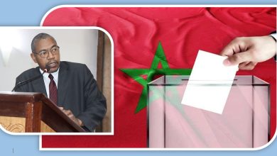 Election-themed collage: man in a suit speaks at a podium, while a hand places a ballot into a transparent ballot box in front of a Moroccan flag.