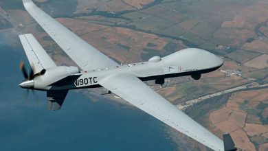 drones-marruecos | MCG24 | موقع إلكتروني مغربي شامل متجدد على مدار الساعة Large white unmanned aircraft with a rear propeller, labeled Experimental, flying over patchwork farmland and coastline.