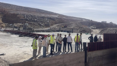 screenshot-2026-06-16-113005 | MCG24 | موقع إلكتروني مغربي شامل متجدد على مدار الساعة Group of people in high-visibility vests standing at a rocky construction site with barriers and equipment in the background.",