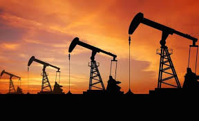 téléchargement 93 | MCG24 | موقع إلكتروني مغربي شامل متجدد على مدار الساعة Silhouetted oil pumpjacks on the horizon during a vivid orange sunset.