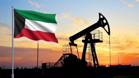 Kuwait flag waving beside an oil pumpjack at sunset, silhouetted foregrounds.