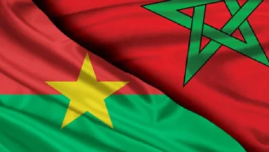 Composite image showing an overlay of Senegal and Morocco flags: green field with a yellow star and a red field with a green pentagram.