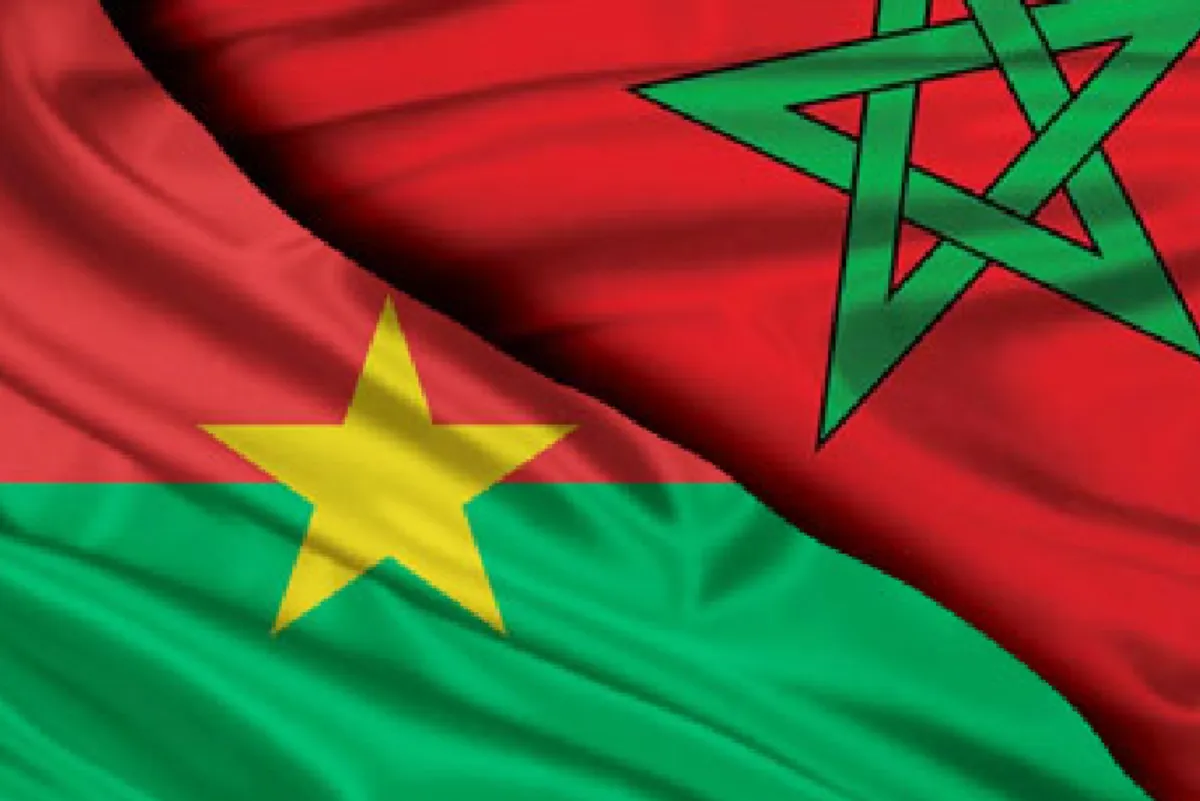Composite image showing an overlay of Senegal and Morocco flags: green field with a yellow star and a red field with a green pentagram.